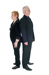 Image showing Senior couple standing back to back.