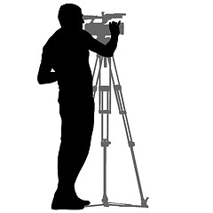 Image showing Cameraman with video camera. Silhouettes on white background