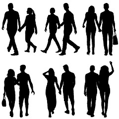 Image showing Set Silhouette man and woman walking hand in hand