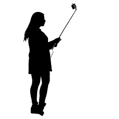 Image showing Silhouettes woman taking selfie with smartphone on white background