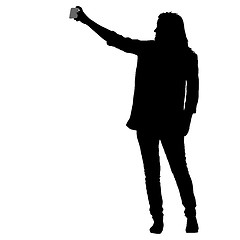 Image showing Silhouettes woman taking selfie with smartphone on white background