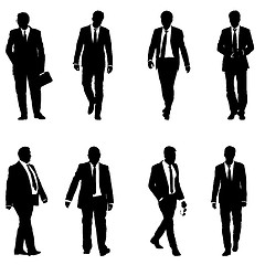 Image showing Set silhouette businessman man in suit with tie on a white background. illustration