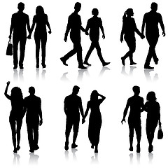 Image showing Set Silhouette man and woman walking hand in hand