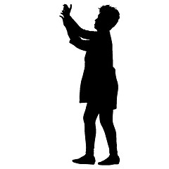 Image showing Silhouettes woman taking selfie with smartphone on white background