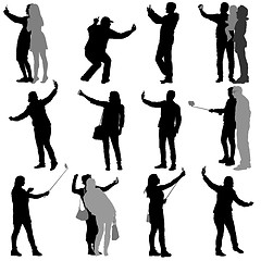 Image showing Set silhouettes man and woman taking selfie with smartphone on white background. illustration