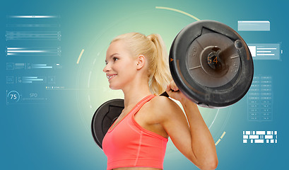 Image showing sporty young woman flexing muscles with barbell