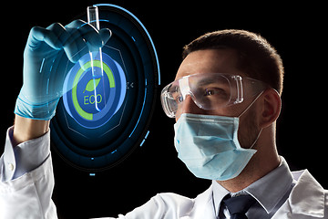 Image showing scientist with test tube and virtual projection