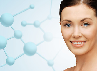 Image showing beautiful young woman face with molecules