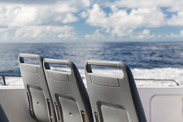 Image showing seats on deck of passenger ship sailing in sea