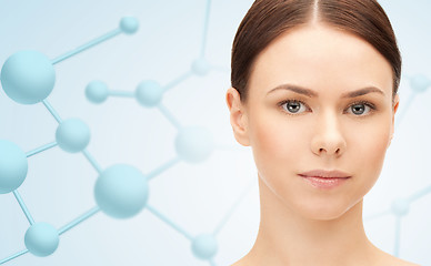 Image showing beautiful young woman face with molecules