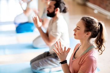 Image showing group of people meditating at yoga studio