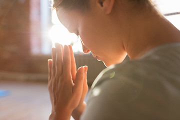 Image showing close up of woman meditating at yoga studio