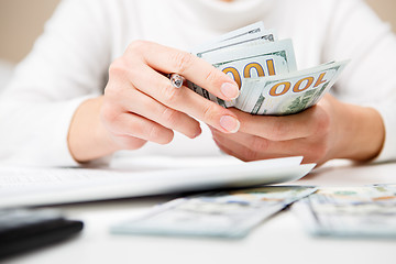 Image showing Hands counting money, close up