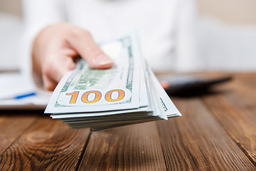 Image showing Hands of person proposing money to you - closeup shot