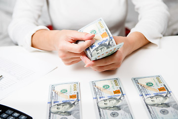 Image showing Hands counting money, close up