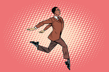 Image showing Elegant businessman runs forward