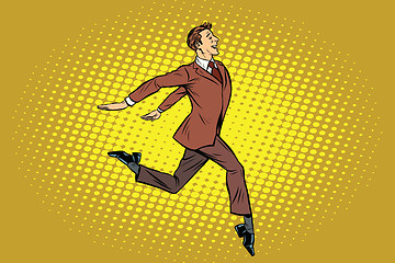 Image showing Elegant businessman runs forward