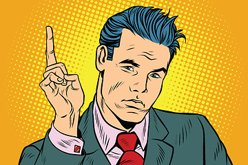 Image showing businessman pointing finger up