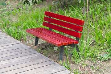 Image showing Red bench in the park outdoors