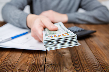 Image showing Hands of person proposing money to you - closeup shot