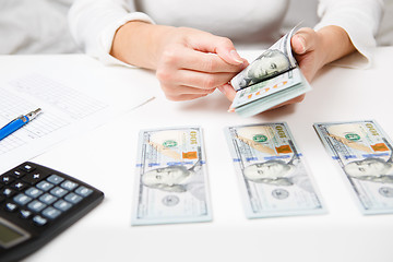 Image showing Hands counting money, close up