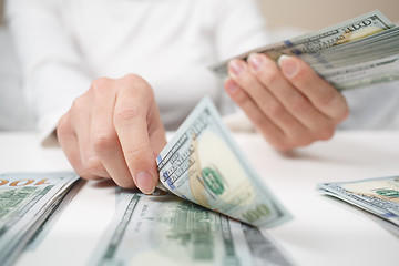 Image showing View of woman hands counting money.