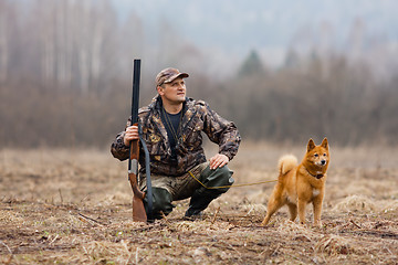 Image showing hunter with gun and dog