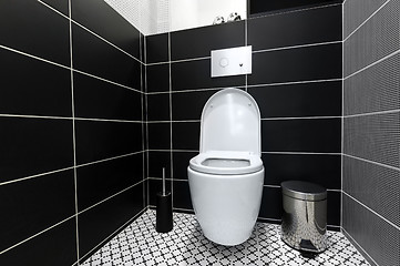 Image showing Modern black and white toilet