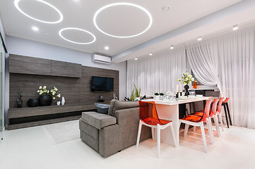 Image showing Modern white living room with dining table