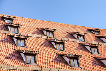 Image showing Tiled roof with mansard windows of attic rooms