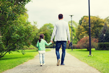 Image showing happy family walking in summer park