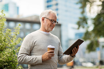 Image showing senior man with tablet pc and coffee in city