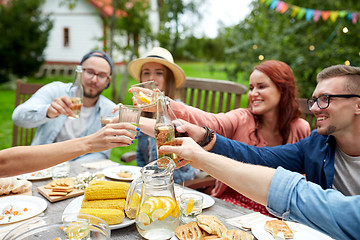 Image showing happy friends with drinks at summer garden party