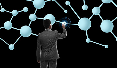 Image showing businessman working with molecule formula