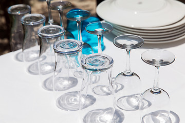 Image showing many clean glasses upside down on table