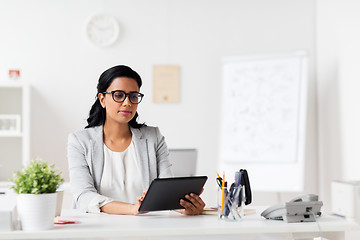 Image showing smiling businesswoman with tablet pc at office