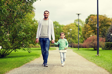 Image showing happy family walking in summer park