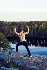 Image showing middle age man doing sport yoga on the top of the mountain, lifestyle people outdoor, summer wild nature for training