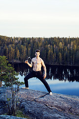 Image showing middle age man doing sport yoga on the top of the mountain, lifestyle people outdoor, summer wild nature for training