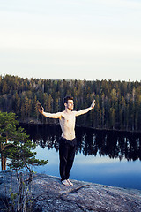 Image showing middle age man doing sport yoga on the top of the mountain, lifestyle people outdoor, summer wild nature for training