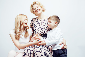 Image showing happy smiling family together posing cheerful on white background, lifestyle people concept, mother with son and teenage daughter isolated