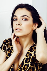 Image showing pretty stylish woman in fashion dress with leopard print together in luxury rich room interior, lifestyle people concept, modern brunette together