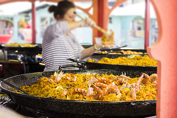 Image showing Seafood paella sold at street market stand