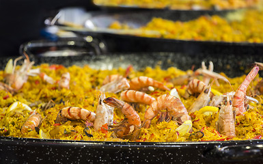 Image showing Seafood paella sold at street market stand