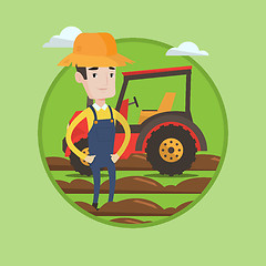 Image showing Farmer standing with tractor on background.