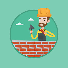 Image showing Bricklayer working with spatula and brick.