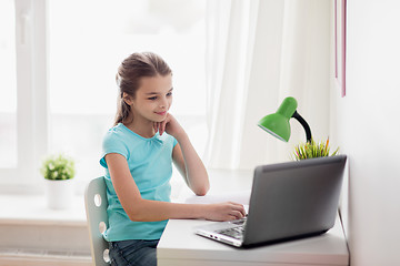 Image showing girl with laptop at home