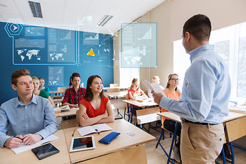 Image showing group of students and teacher with papers or tests