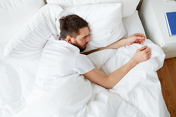 Image showing man sleeping in bed at home bedroom