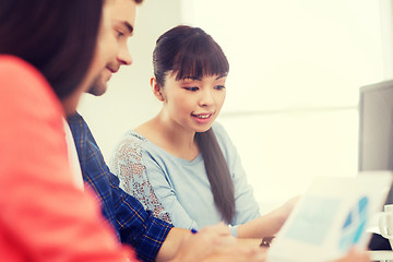 Image showing happy creative team or students working at office